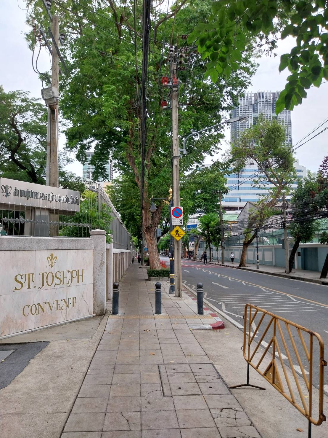 Opposite the school